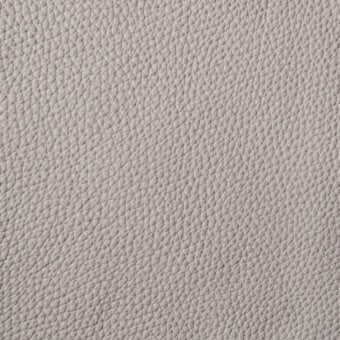 Light gray pebble-grain leather texture with a repeating pattern of small bumps and indentations, exhibiting a matte finish and subtle tonal variations.